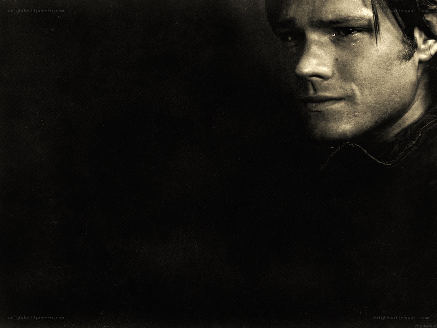 man with tear in eye