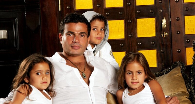 man with three children