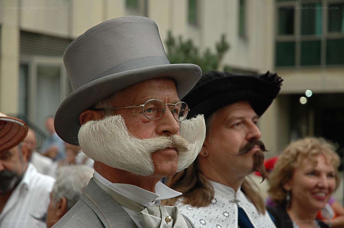 Man with top hat and large mustache