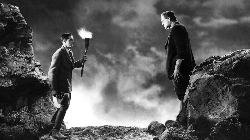 Man with Torch Facing Monster