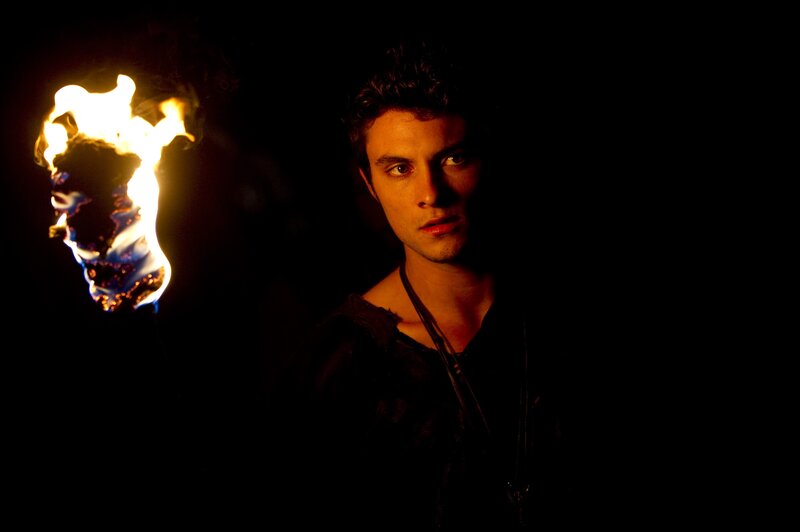 man with torch in dark