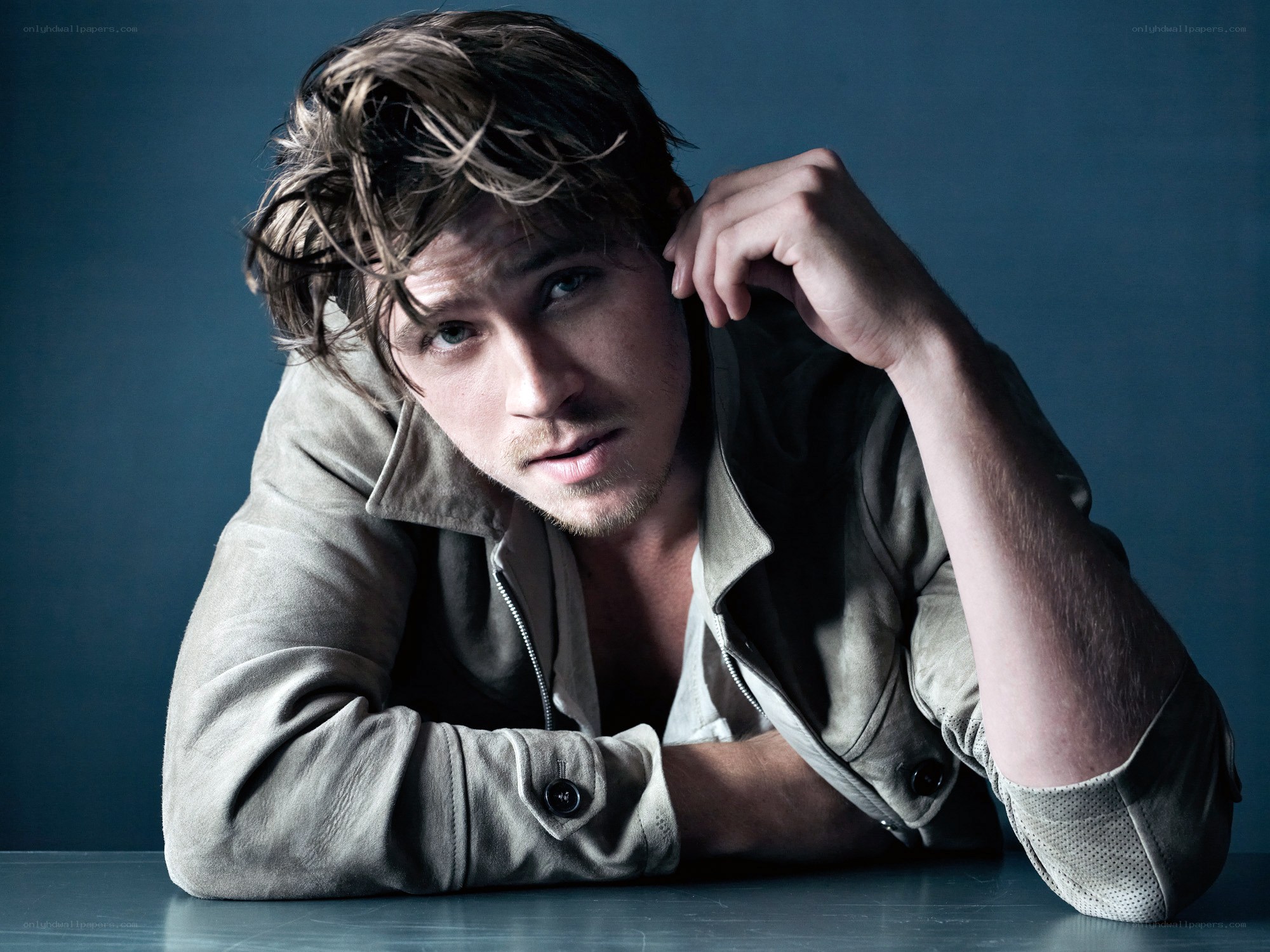 man with tousled hair posing