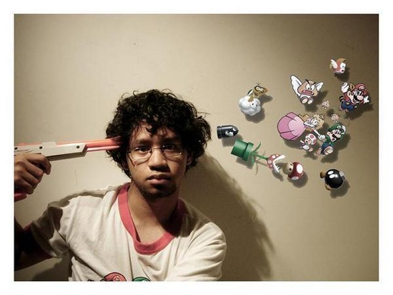 Man with toy gun and Mario figures