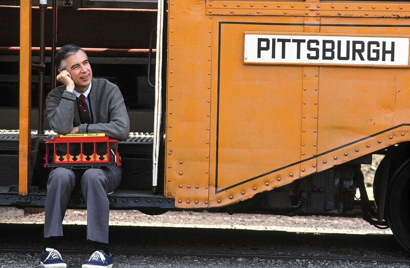 Man with trolley model on train
