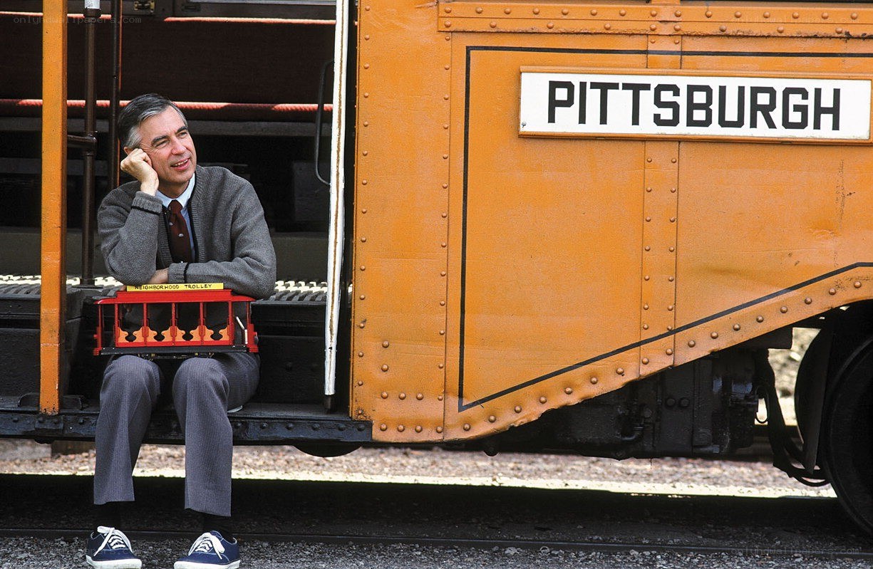 Man with trolley model on train