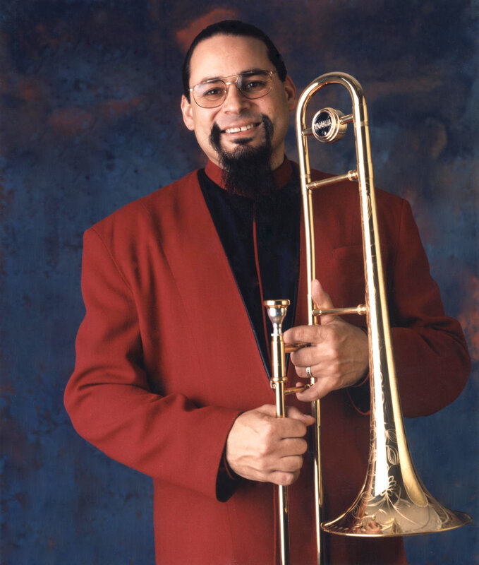 Man with trombone in red jacket