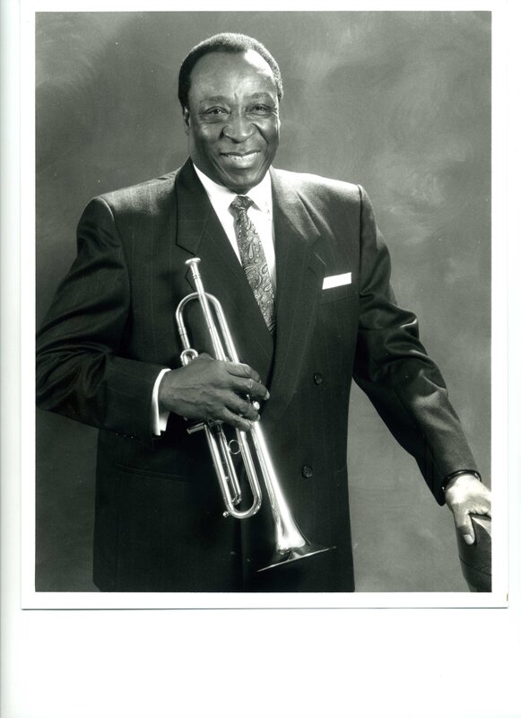 Man with trumpet in suit