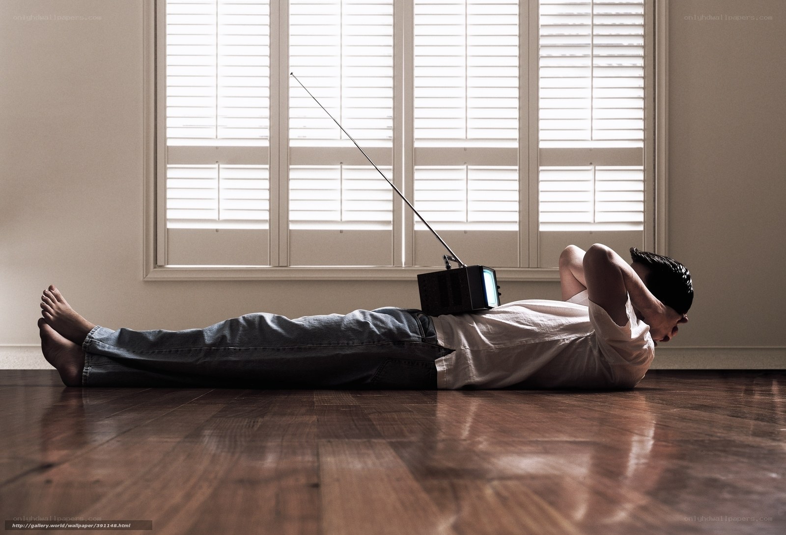 Man with TV on floor