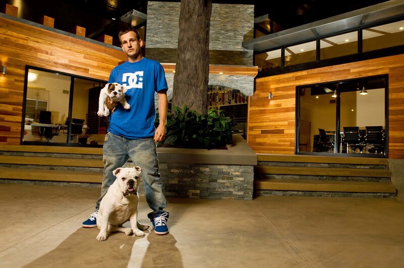 Man with two bulldogs in modern office