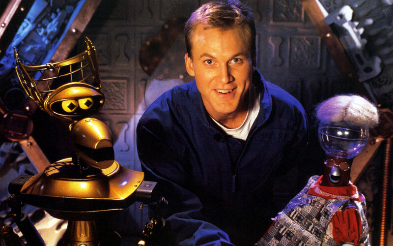 Man with two robots