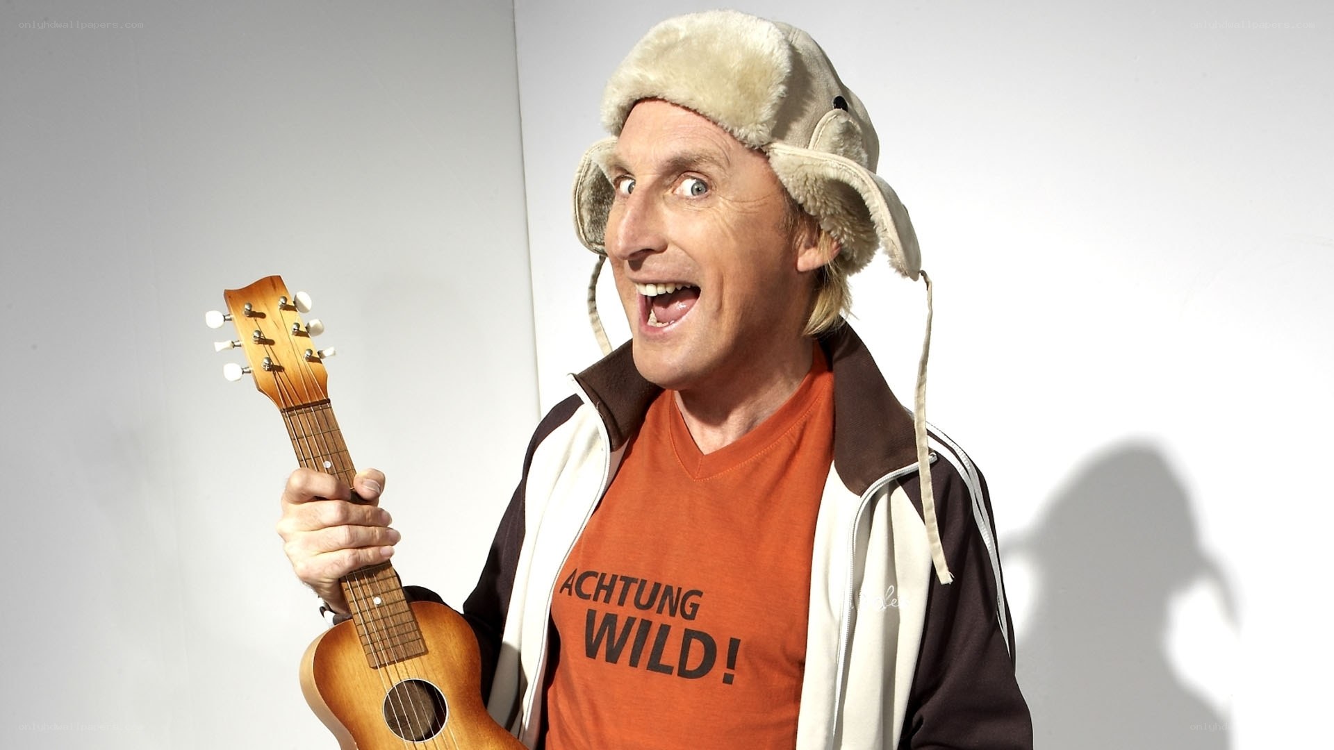 Man with ukulele and hat