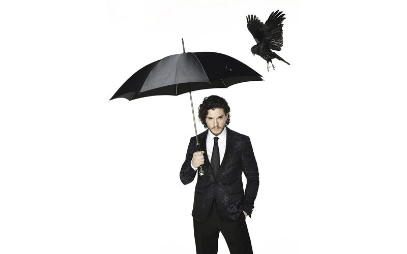 man with umbrella and crow