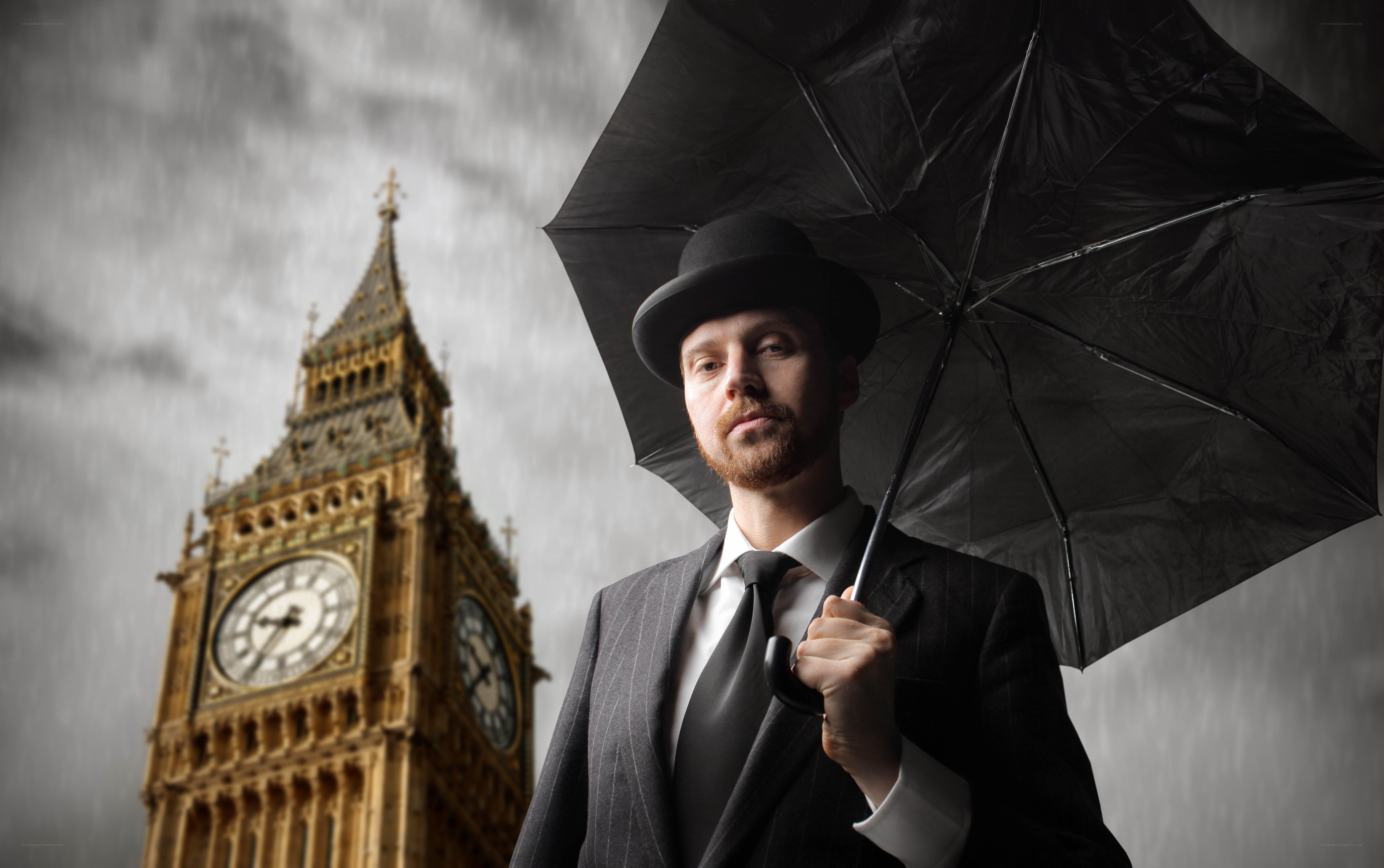 Man with umbrella in London