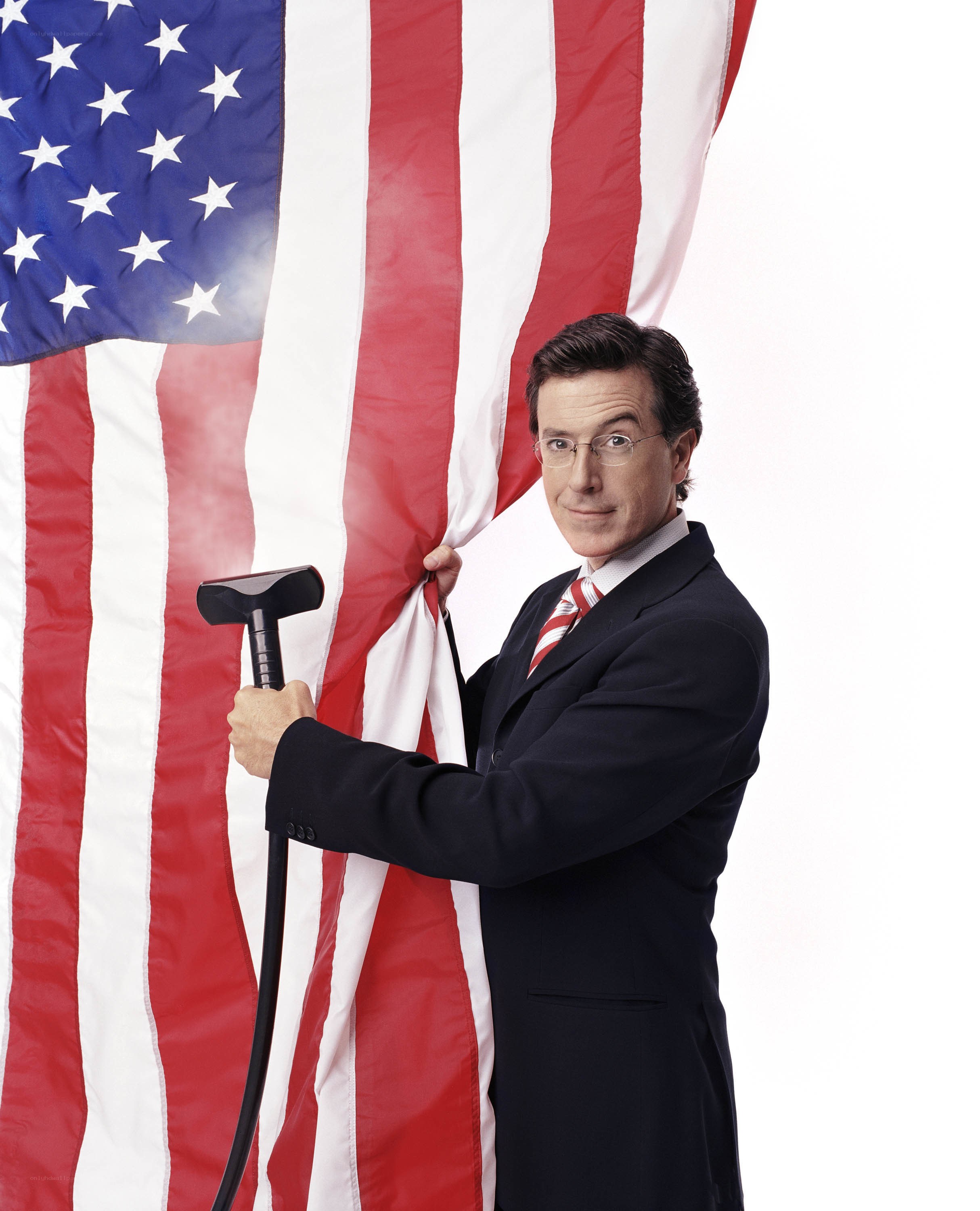 Man with vacuum and American flag
