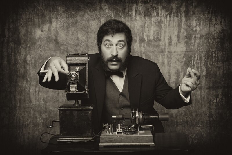 Man with vintage camera and machine