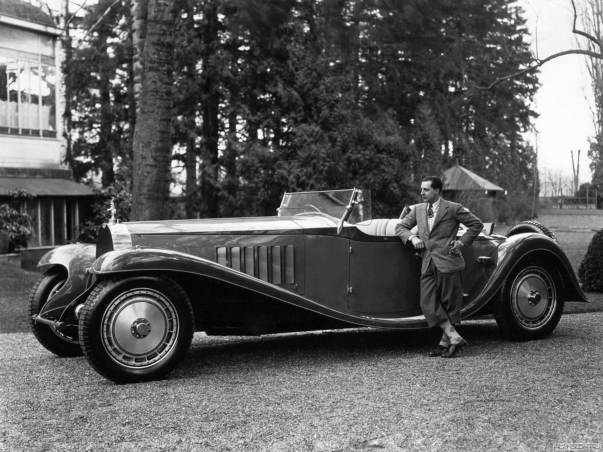 Man with vintage car