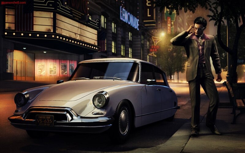 man with vintage car at night