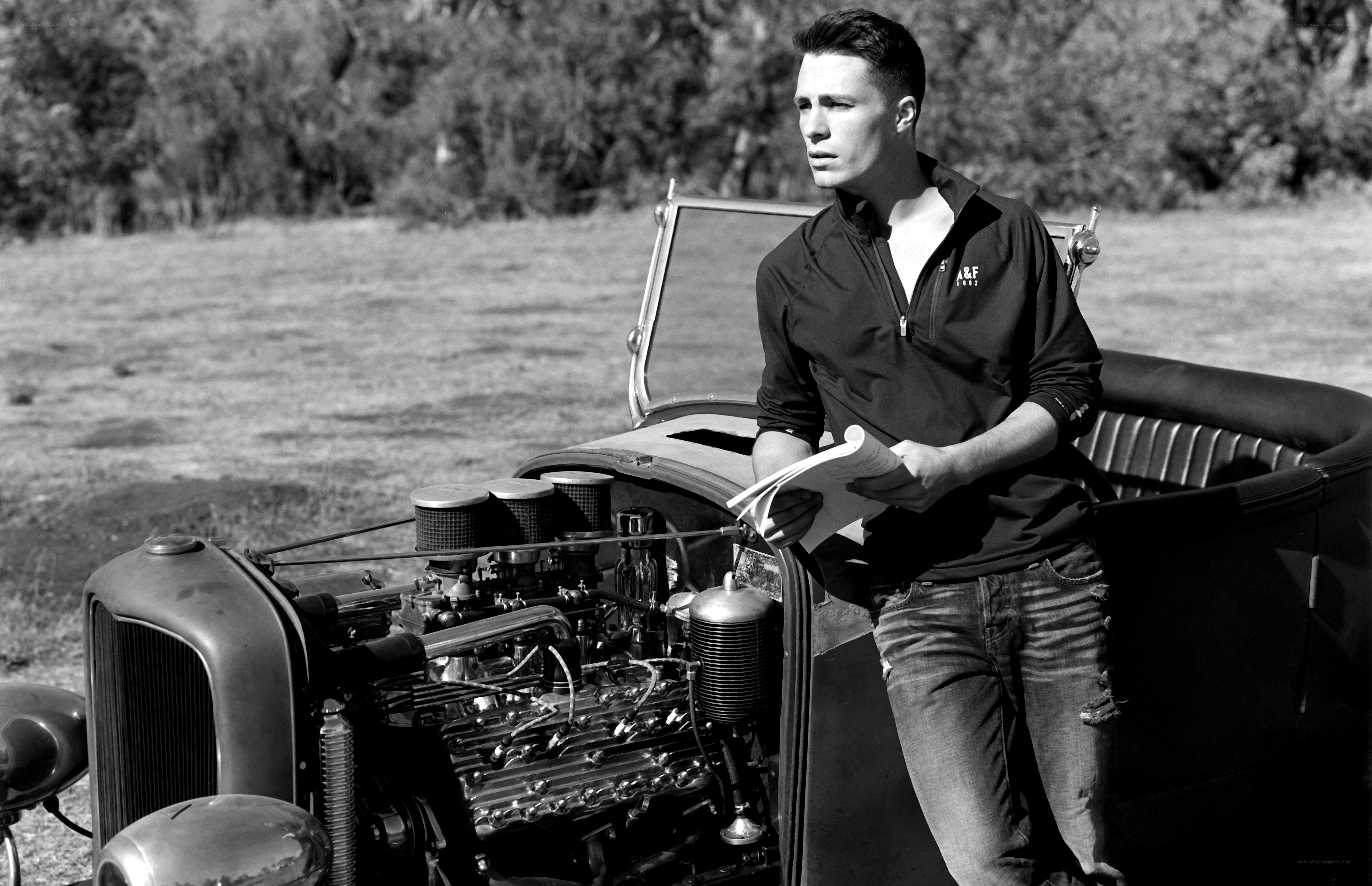 man with vintage car engine
