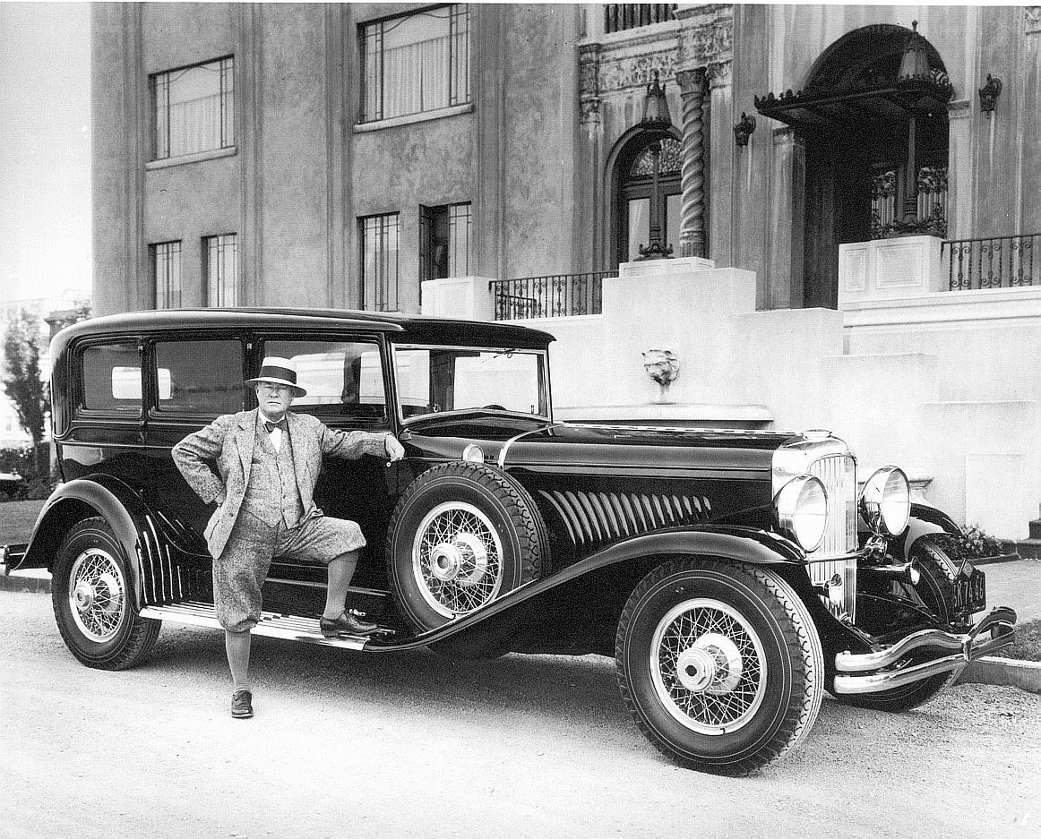 Man with vintage car