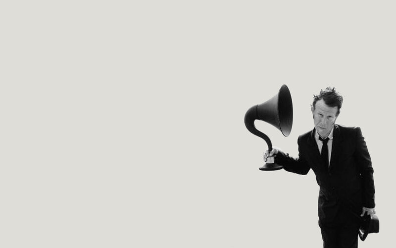 man with vintage gramophone