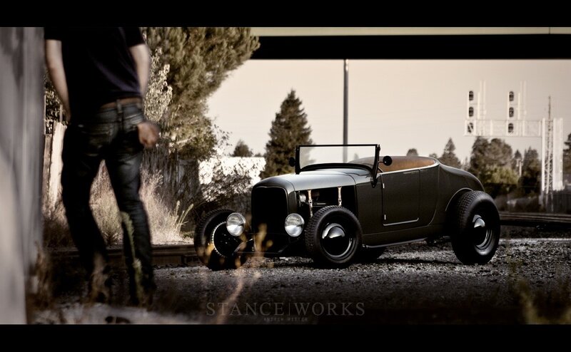 Man with vintage hot rod car