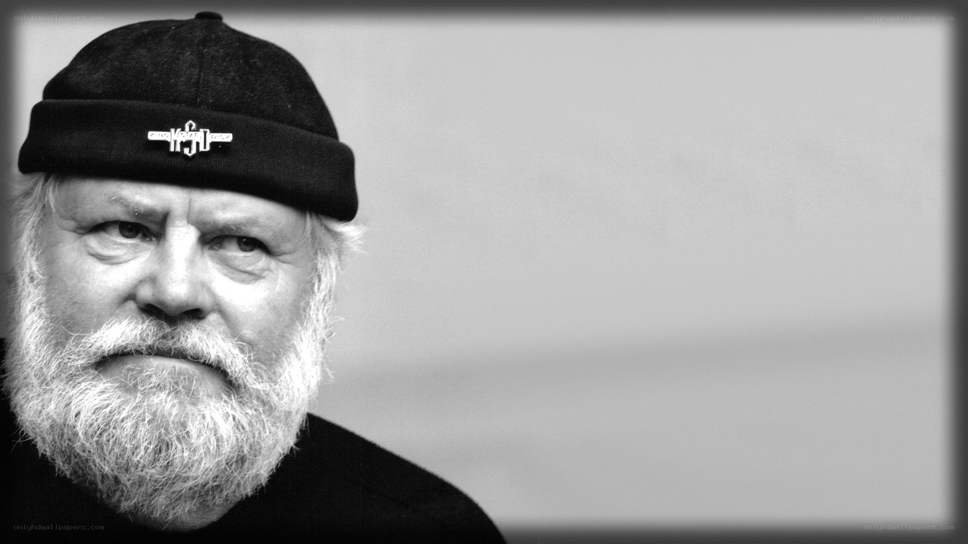 man with white beard and beanie