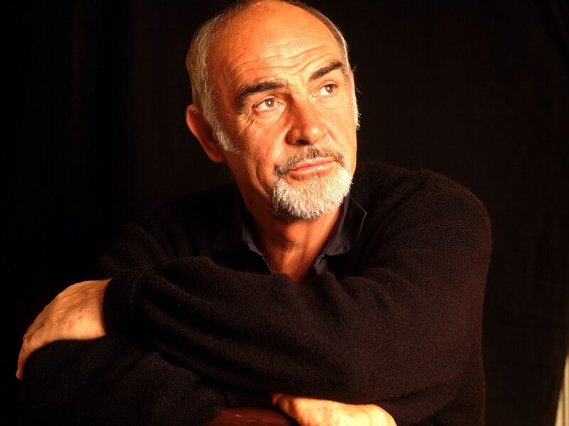 man with white beard in dark sweater