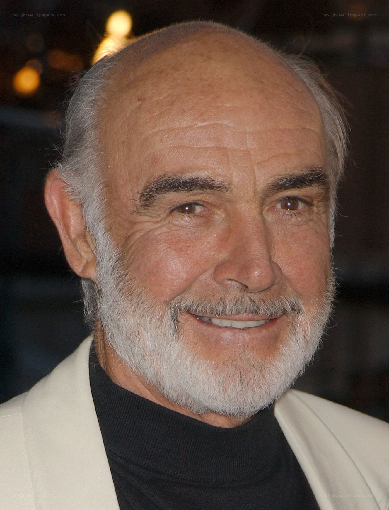 man with white beard smiling