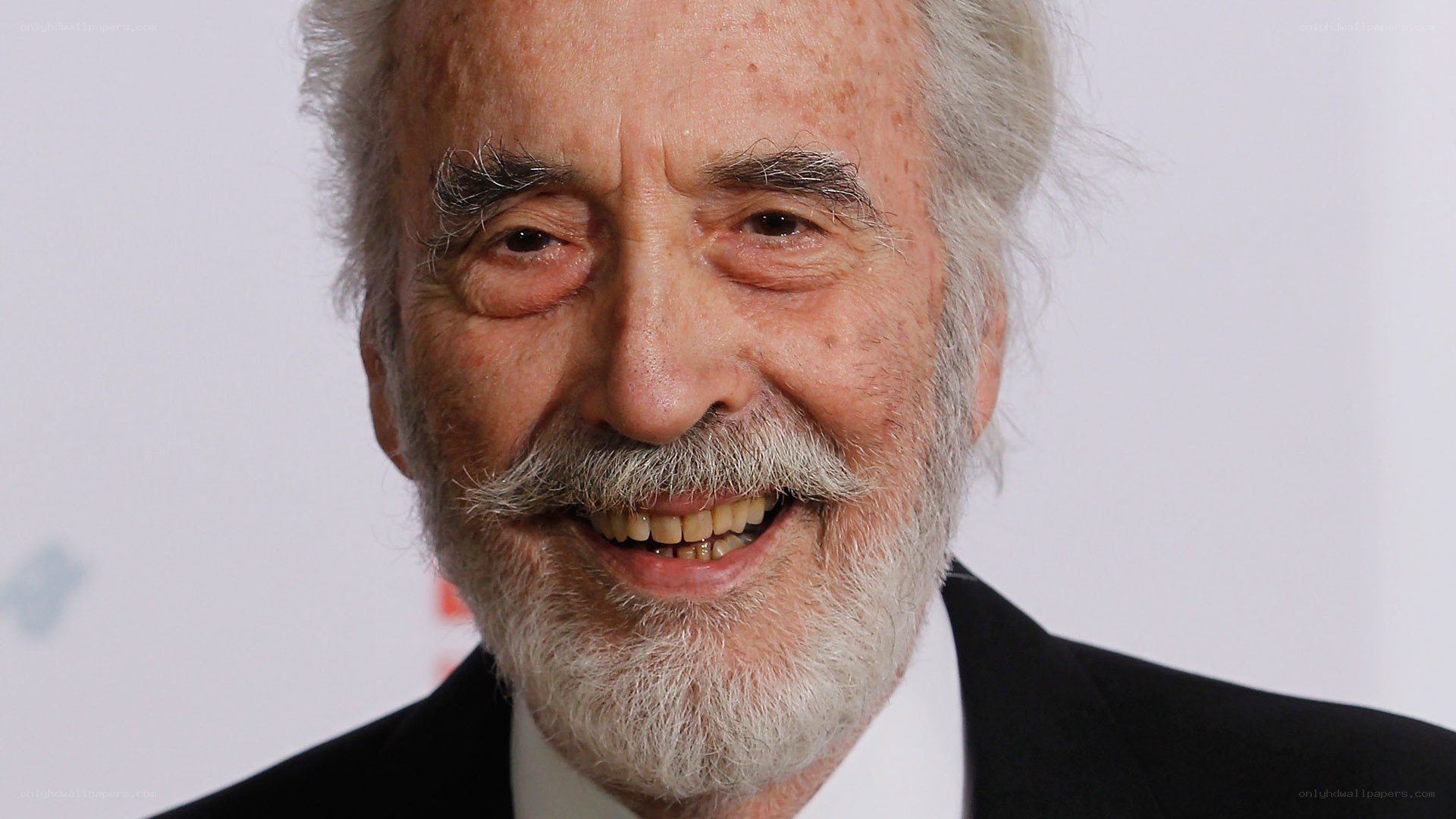man with white beard smiling