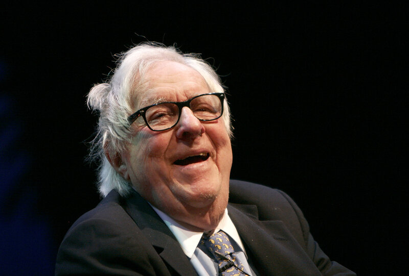 man with white hair and glasses
