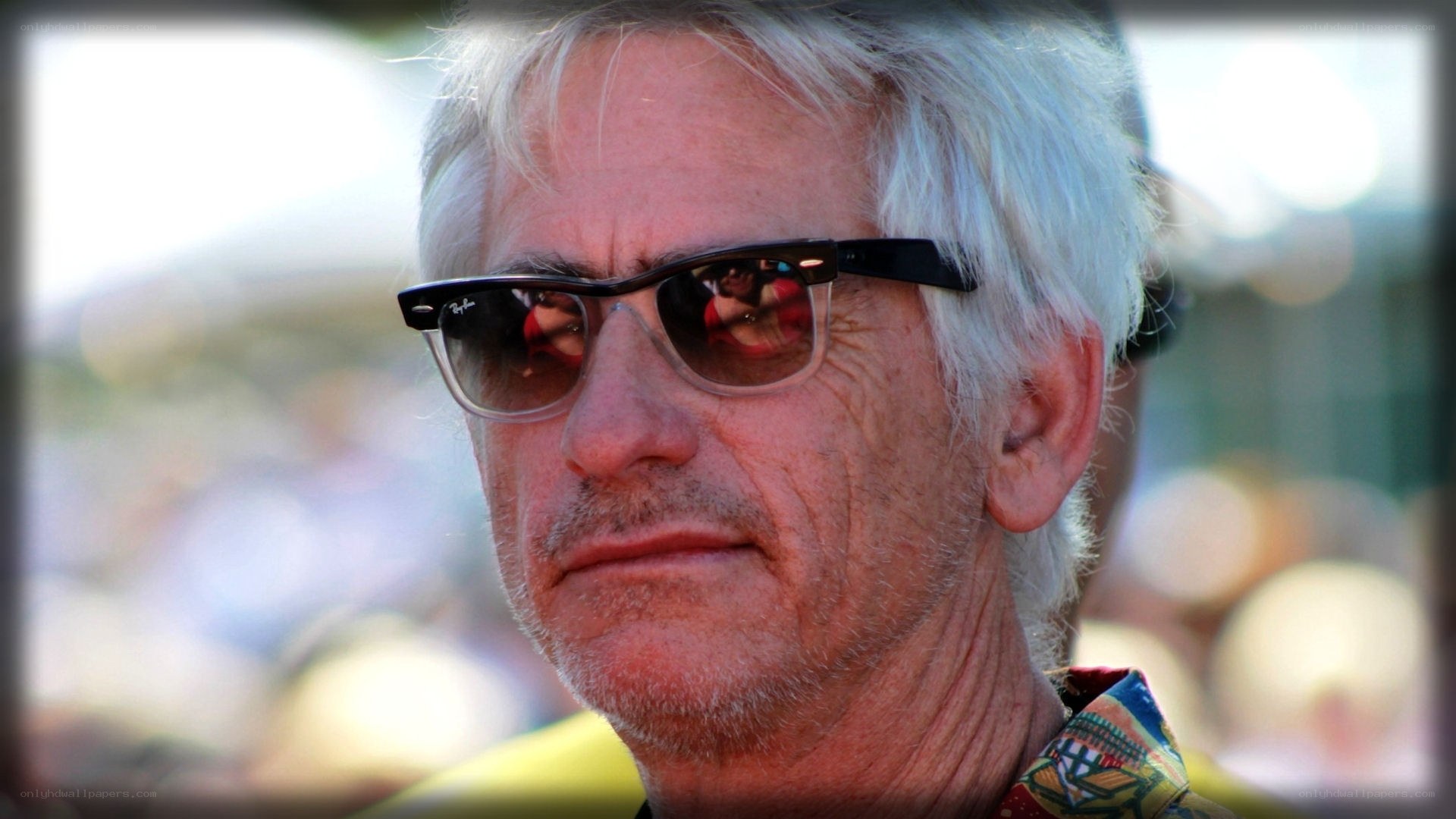man with white hair and sunglasses