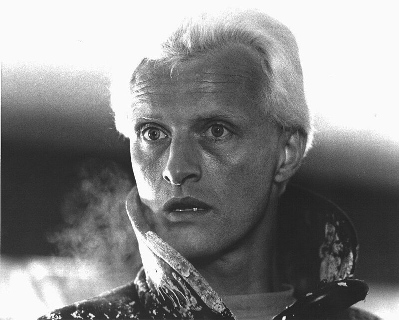 man with white hair in distress