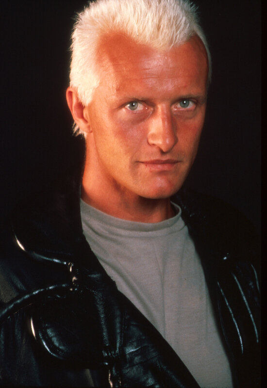Man with white hair in leather jacket