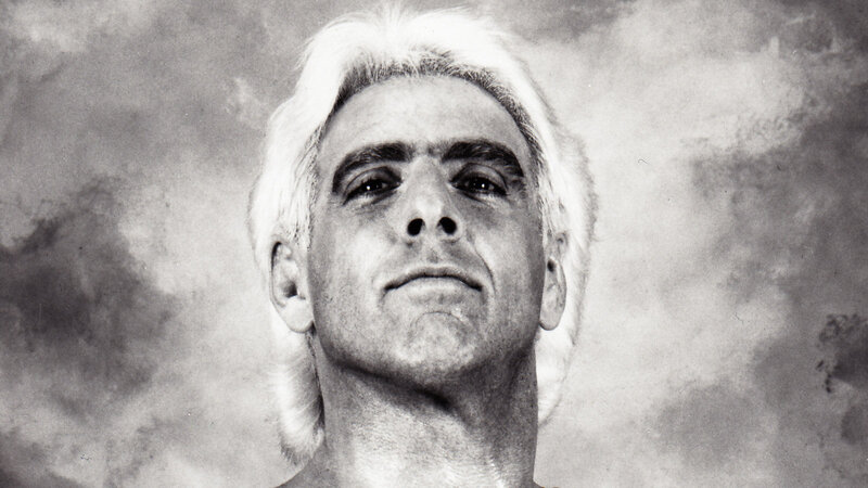 man with white hair looking up