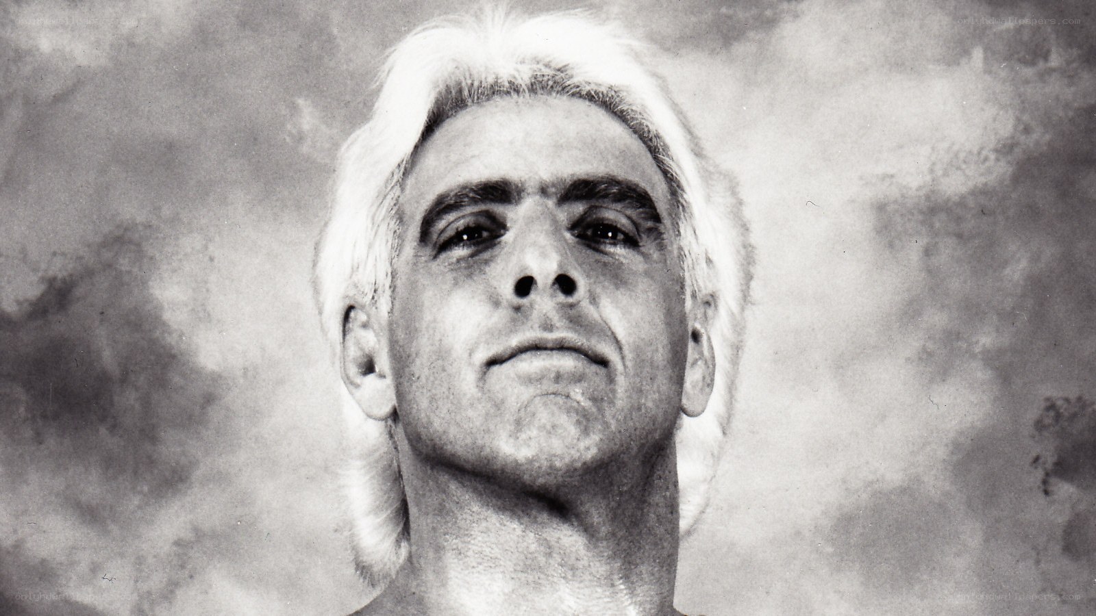 man with white hair looking up