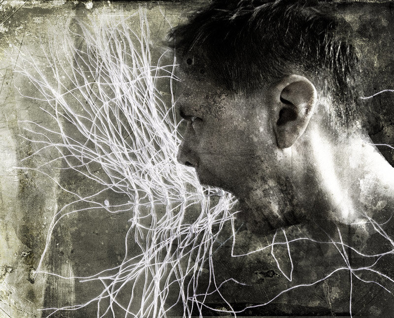 man with white lines on face