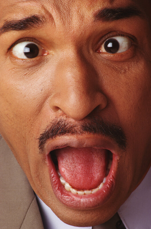 man with wide eyes and open mouth