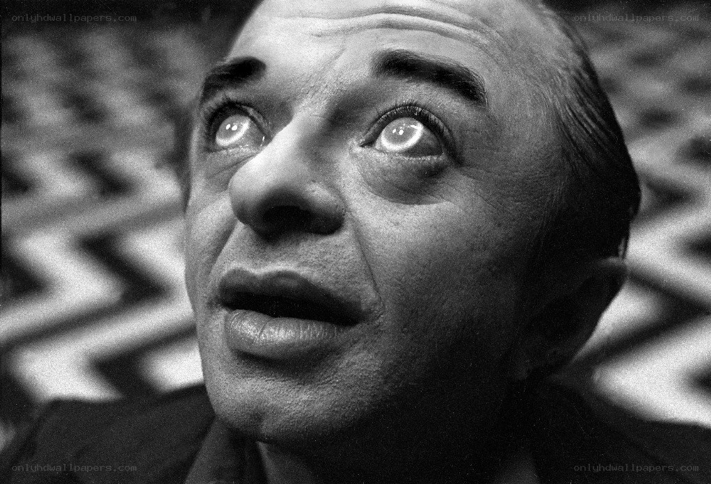 man with wide eyes looking up