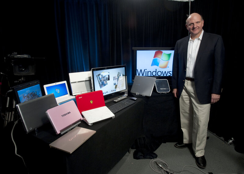 Man with Windows laptops