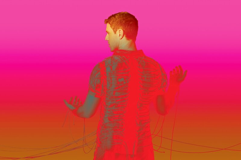 man with wires on back
