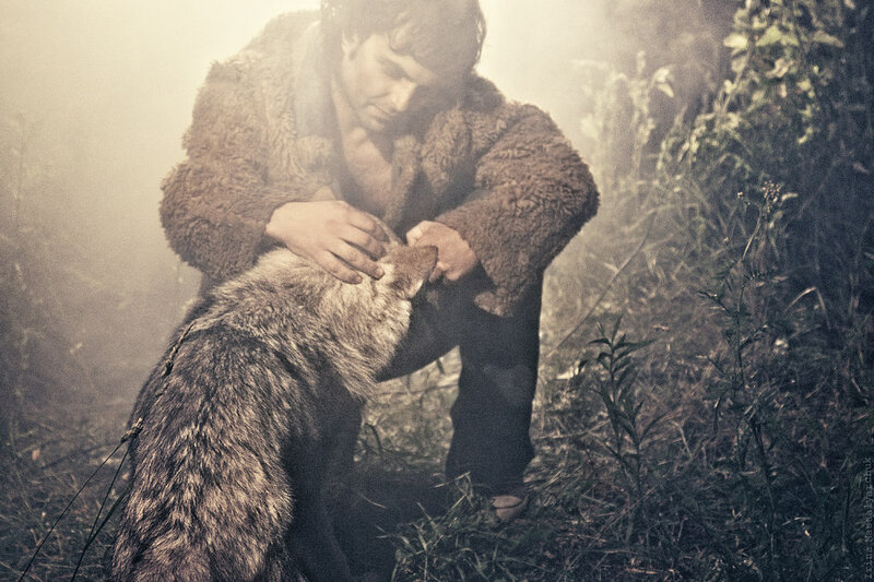 Man with Wolf in Forest