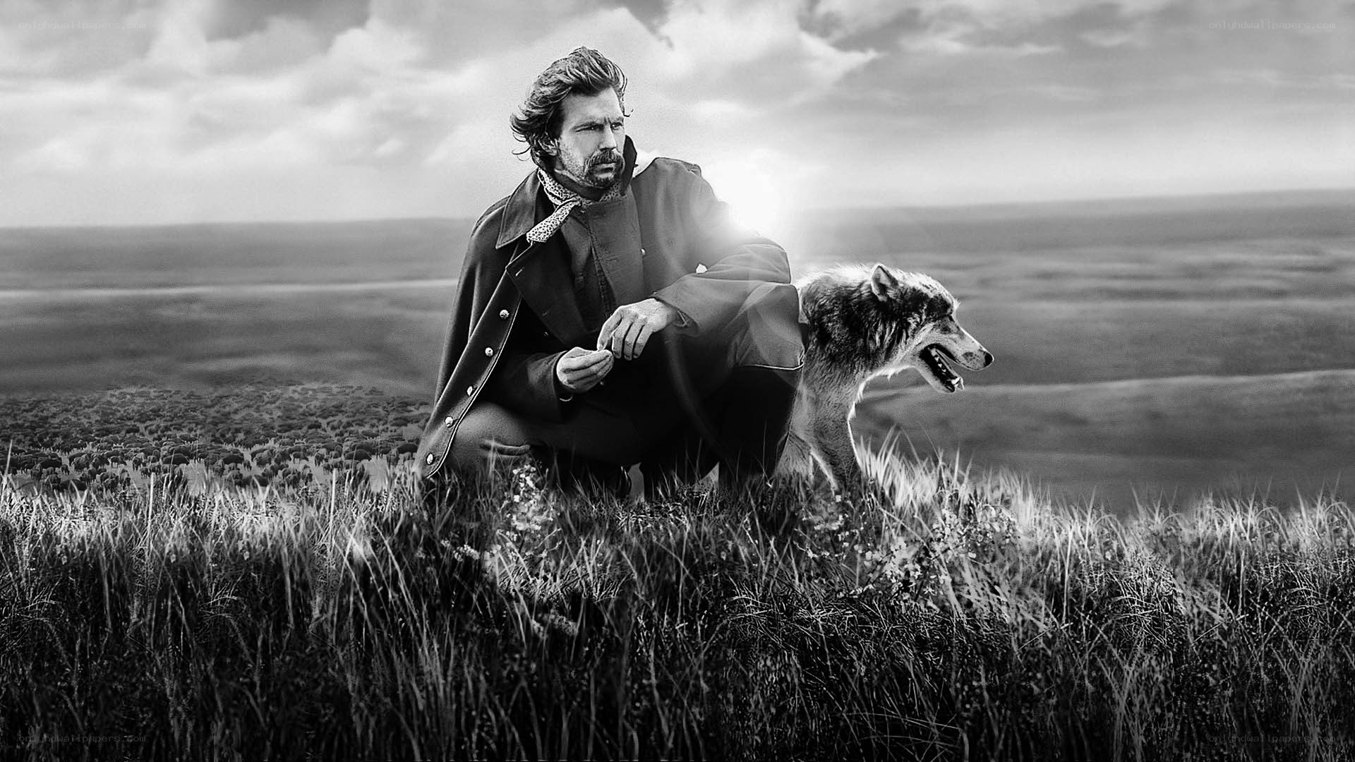 man with wolf on a hill