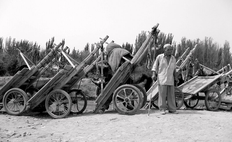 Man with wooden carts