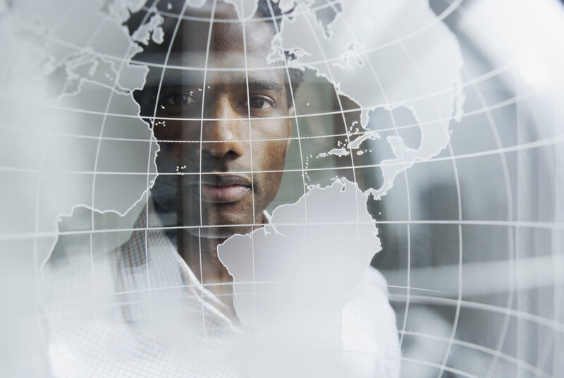 Man with World Map Overlay