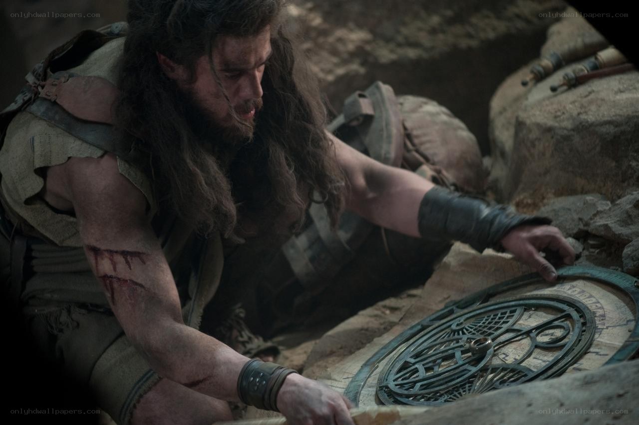 man with wounds examining artifact
