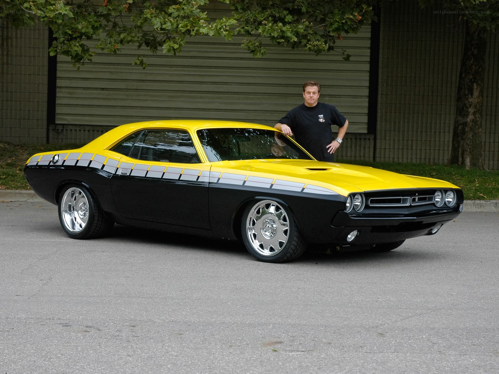 Man with yellow muscle car