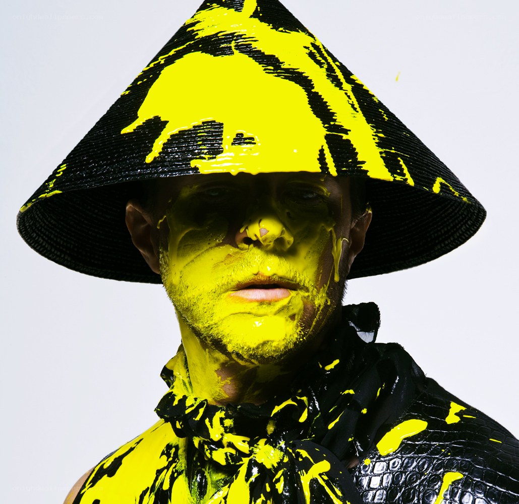 man with yellow paint on face