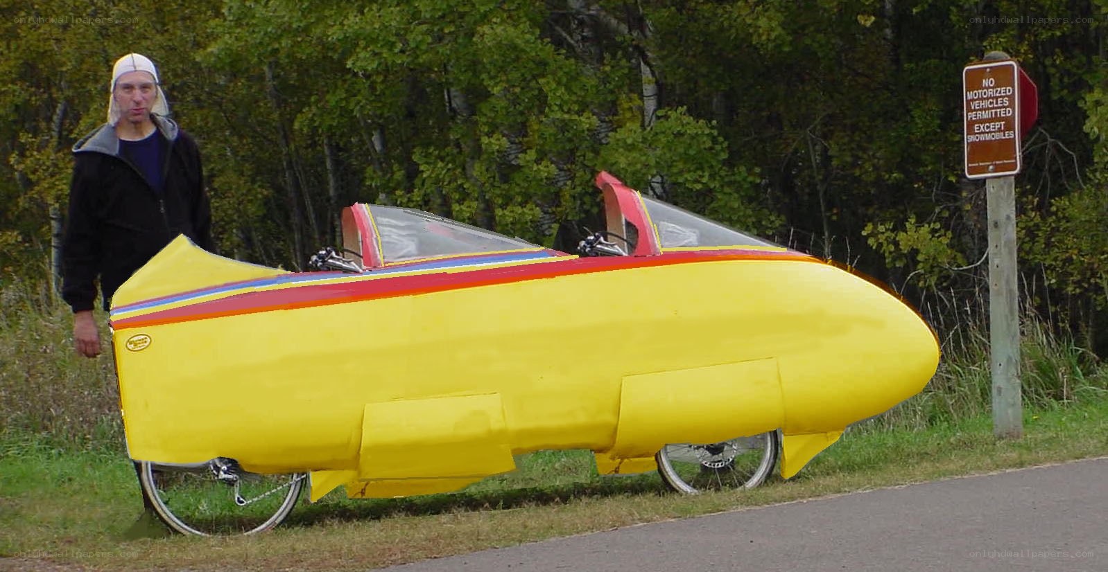 Man with yellow recumbent bike