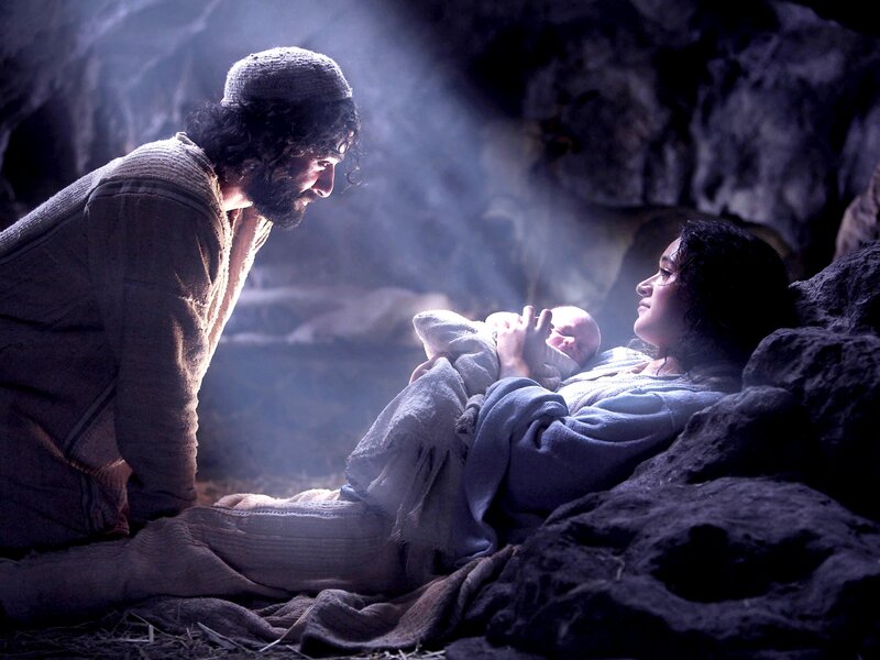 Man Woman Baby in Cave
