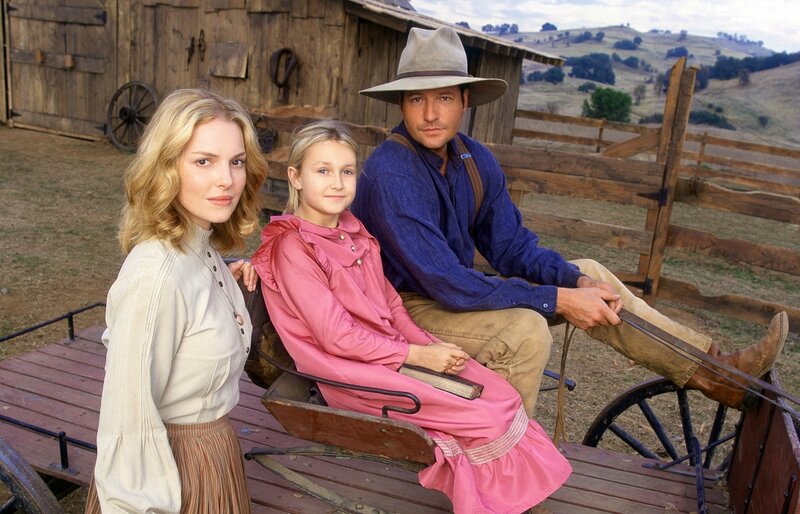 Man Woman Girl on Wagon